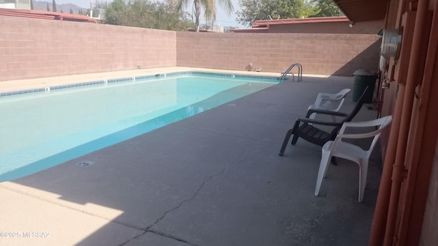 view of pool featuring a fenced in pool and a fenced backyard