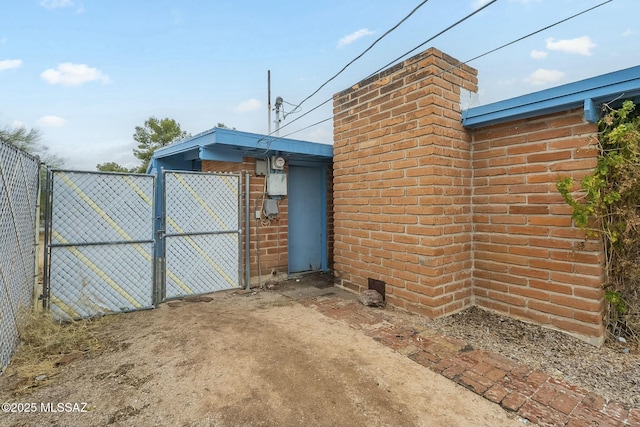 view of gate featuring fence