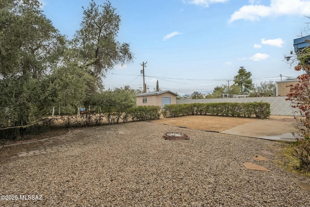 view of yard featuring a patio area and fence