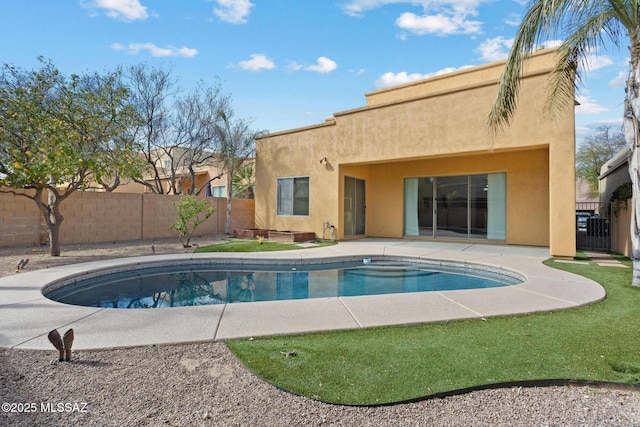 view of pool featuring fence, a fenced in pool, and a patio