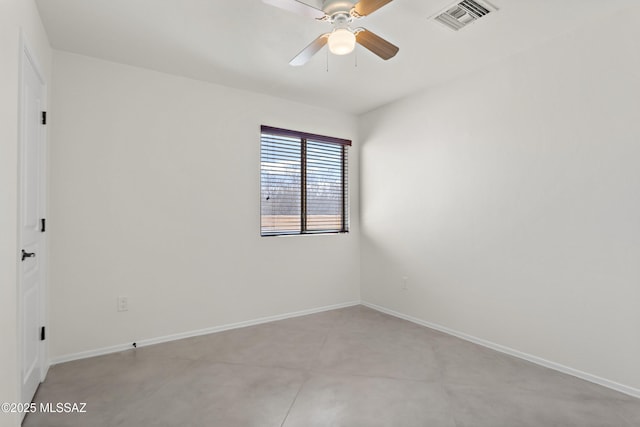empty room featuring ceiling fan, visible vents, and baseboards