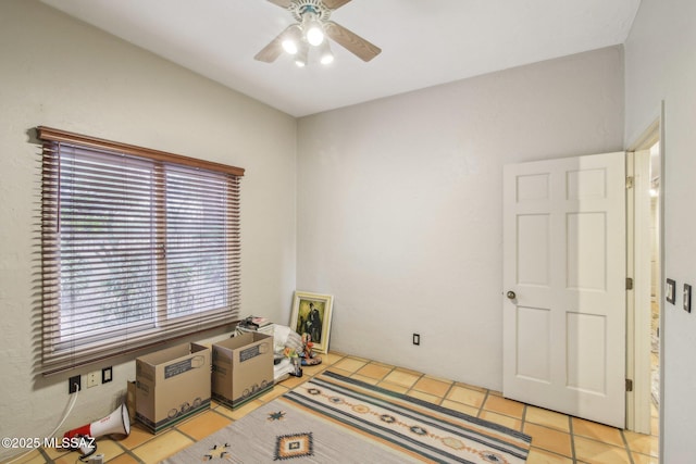 interior space featuring ceiling fan and light tile patterned floors