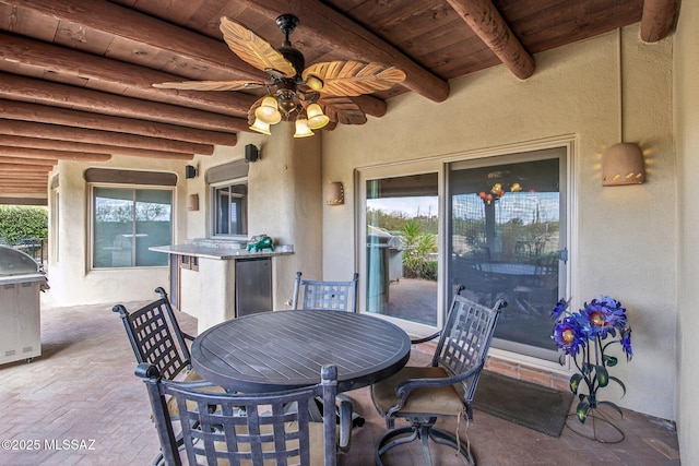 view of patio / terrace featuring ceiling fan and a grill