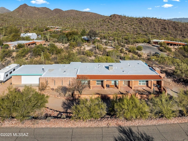 birds eye view of property with a mountain view