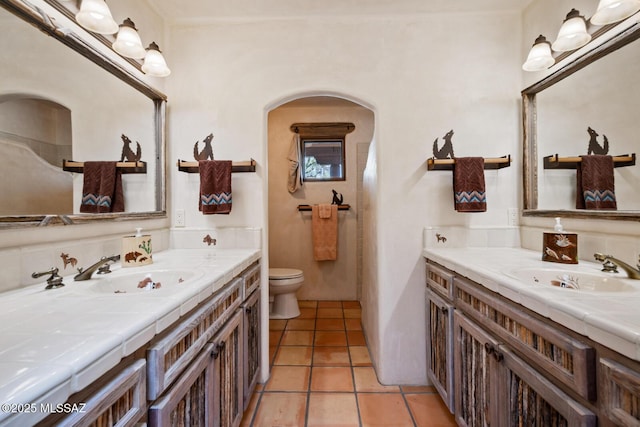 full bathroom featuring tile patterned floors, toilet, and vanity