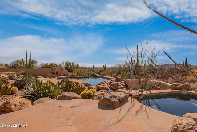 pool featuring a patio area