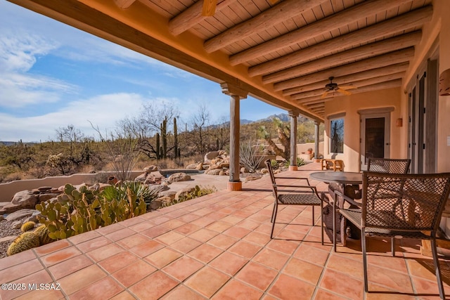 view of patio / terrace featuring outdoor dining area and ceiling fan