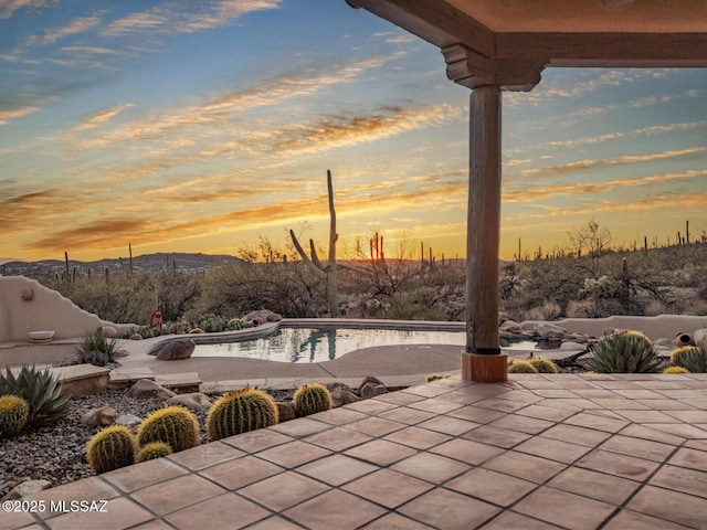 view of patio featuring a mountain view and an outdoor pool