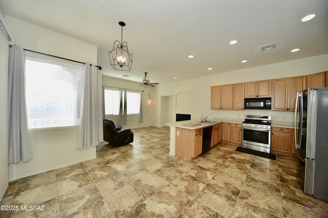 kitchen featuring light countertops, visible vents, open floor plan, a peninsula, and black appliances