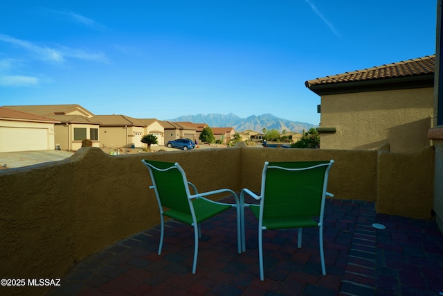 exterior space featuring a mountain view and a balcony