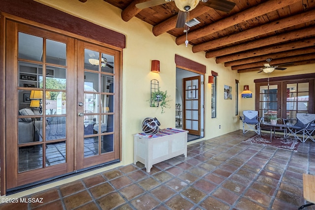 view of patio / terrace with a ceiling fan and french doors