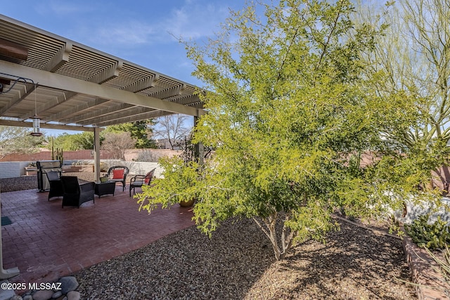 view of yard with an outdoor hangout area, a patio, fence, and a pergola