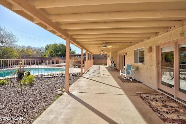 1660 N Fox Run Pl, Tucson, AZ 85715 - view of patio with a fenced backyard, ceiling fan, and a fenced in pool