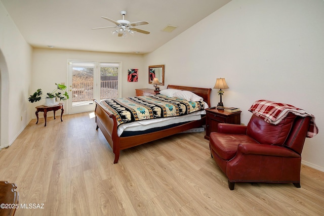1660 N Fox Run Pl, Tucson, AZ 85715 - bedroom featuring visible vents, access to exterior, light wood finished floors, and vaulted ceiling