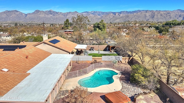 1660 N Fox Run Pl, Tucson, AZ 85715 - view of pool with a mountain view, a patio, a fenced backyard, and a fenced in pool