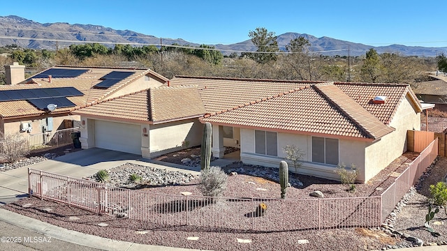 1660 N Fox Run Pl, Tucson, AZ 85715 - view of front of property featuring a tiled roof, an attached garage, fence private yard, stucco siding, and driveway