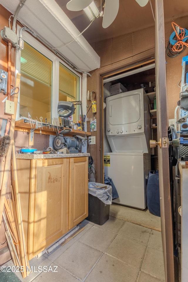 laundry room with stacked washer and clothes dryer