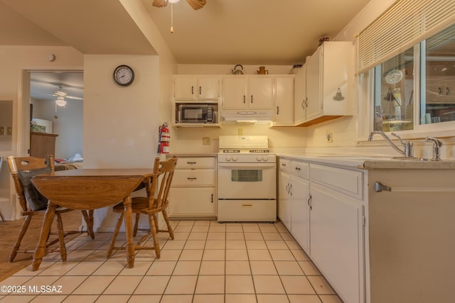 kitchen featuring sink, ceiling fan, white cabinetry, built in microwave, and white range with gas cooktop