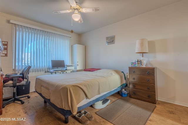 bedroom featuring ceiling fan and light wood-type flooring