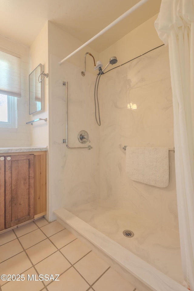 bathroom with vanity, tile patterned floors, and a shower with curtain