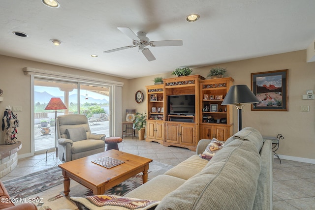 living room featuring ceiling fan and light tile patterned floors