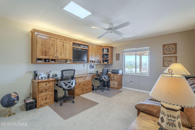 home office with ceiling fan and light colored carpet