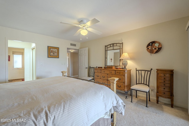 bedroom featuring light carpet and ceiling fan