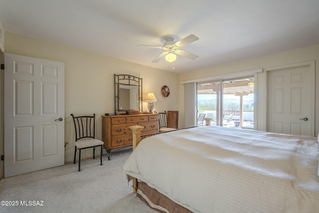 carpeted bedroom with ceiling fan and access to exterior