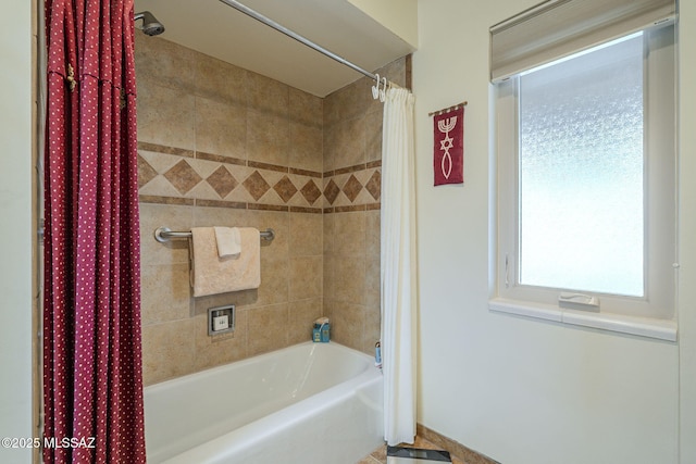 bathroom with shower / tub combo