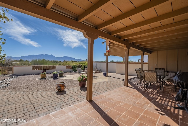 view of patio / terrace featuring a mountain view