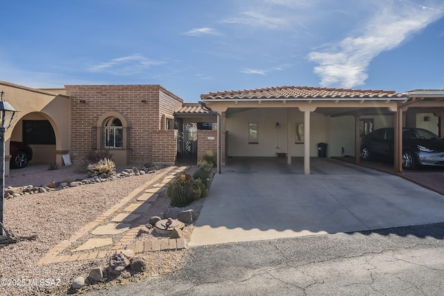 mediterranean / spanish home with a carport