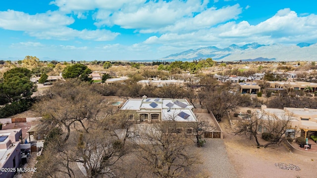 drone / aerial view featuring a residential view and a mountain view