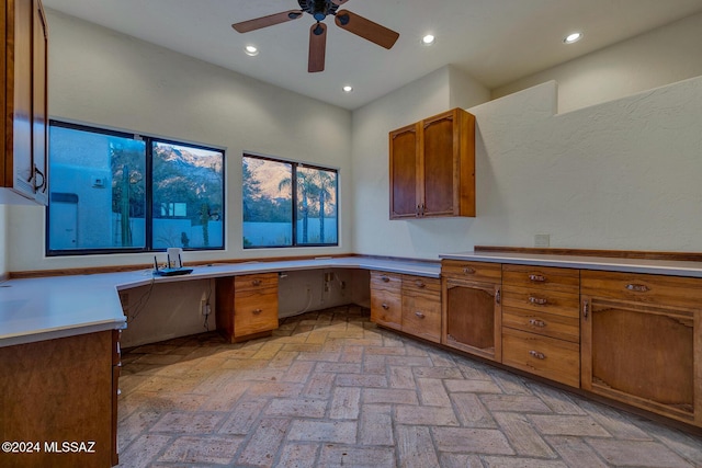 kitchen with built in desk and ceiling fan