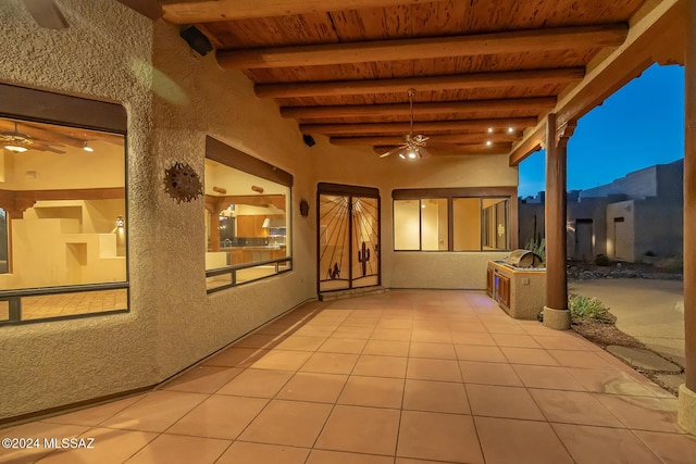 view of patio terrace at dusk