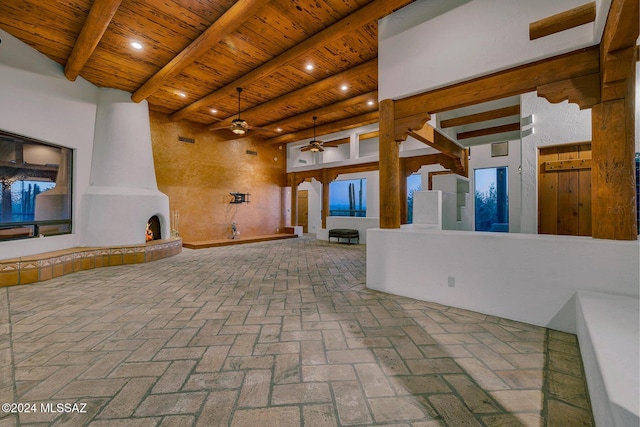 view of patio / terrace with a fireplace and ceiling fan