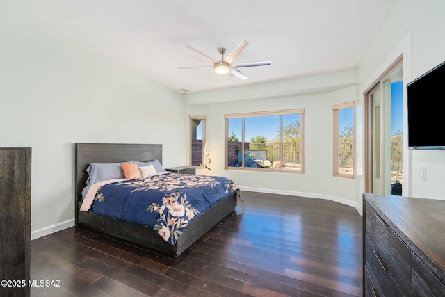 bedroom with dark hardwood / wood-style floors and ceiling fan