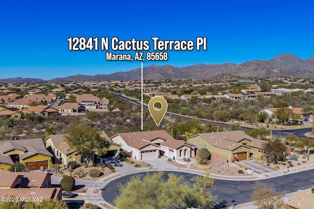 birds eye view of property with a mountain view