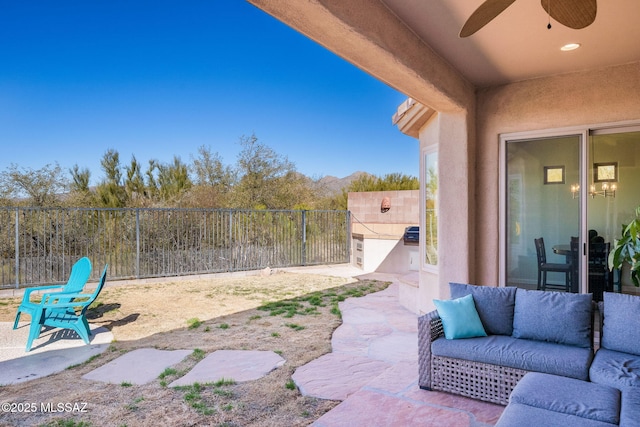 view of patio featuring ceiling fan and outdoor lounge area