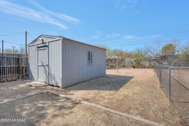 view of shed with a fenced backyard