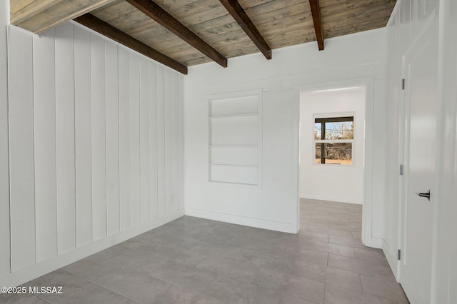 empty room with wooden ceiling and beam ceiling