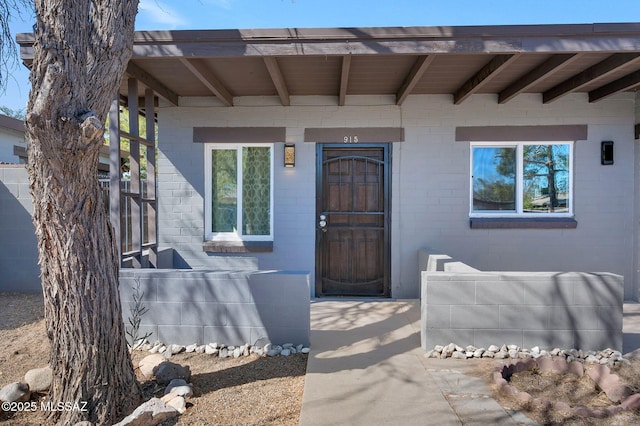 entrance to property with brick siding