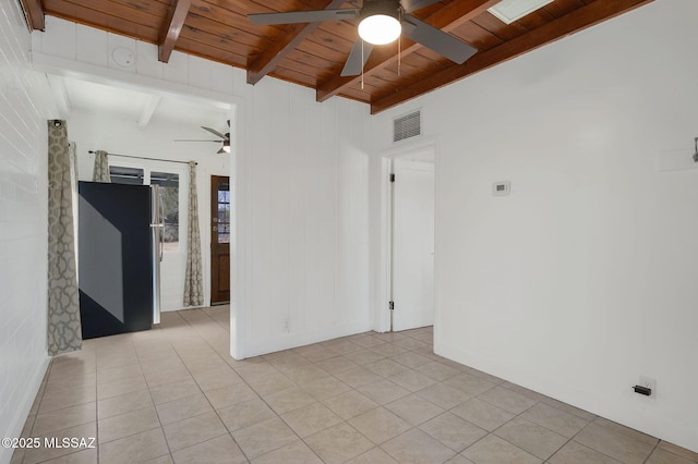 unfurnished room with light tile patterned floors, visible vents, a ceiling fan, wooden ceiling, and beam ceiling