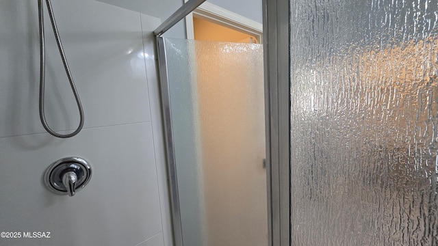 room details featuring an enclosed shower