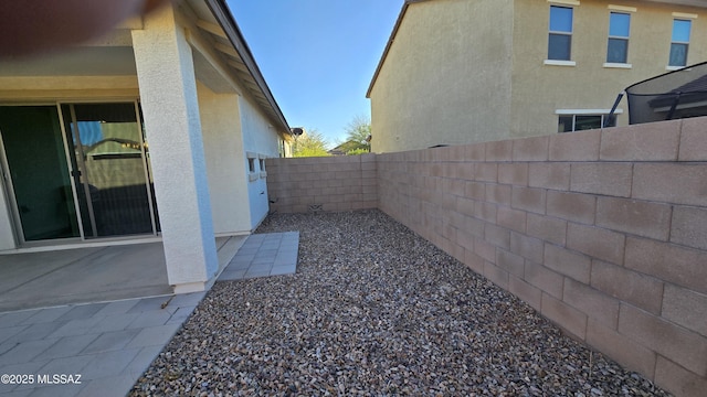 view of yard with a fenced backyard and a patio area
