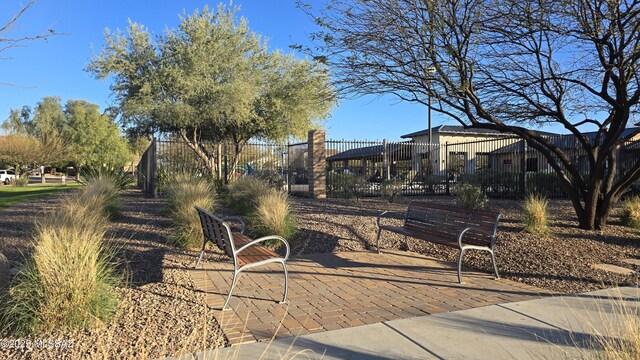 view of community featuring fence