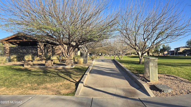 surrounding community featuring a yard