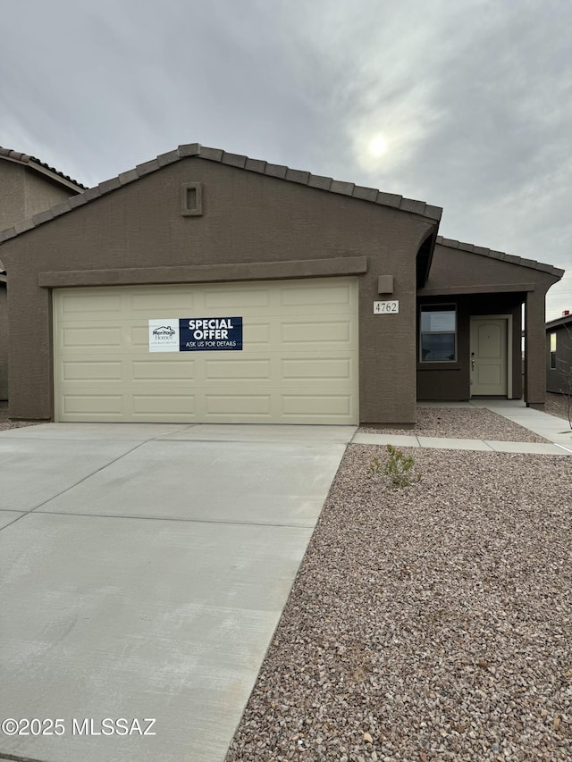 view of front of property with a garage