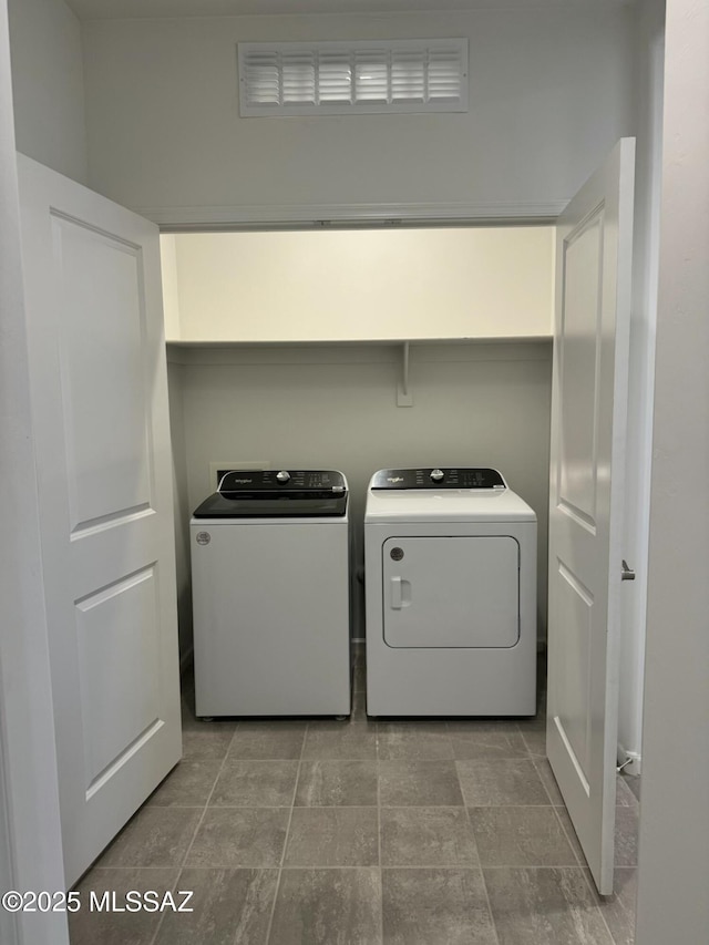 laundry room featuring independent washer and dryer