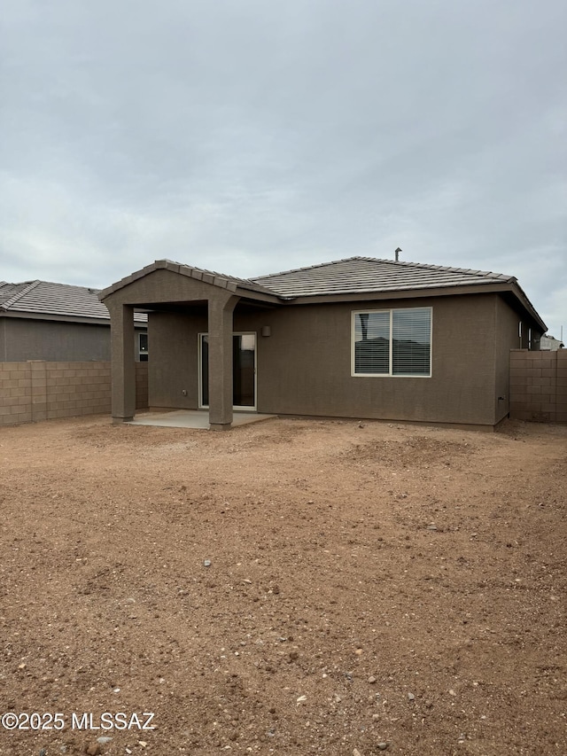 back of property with a patio area