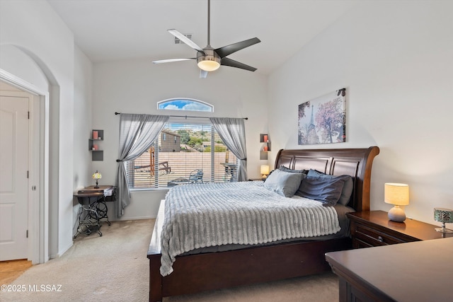 bedroom featuring lofted ceiling, light carpet, ceiling fan, and baseboards